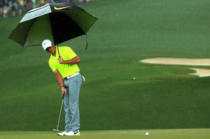 Rory McIlroy playing in the rain