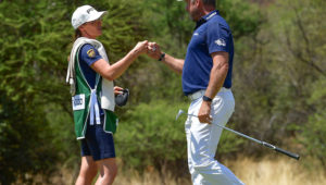 Helen Storey caddies for Lee Westwood