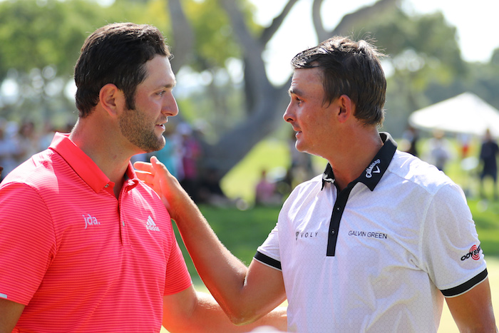 Christian Bezuidenhout of South Africa is congratulated on his victory on the 18th green by Jon Rahm of Spain