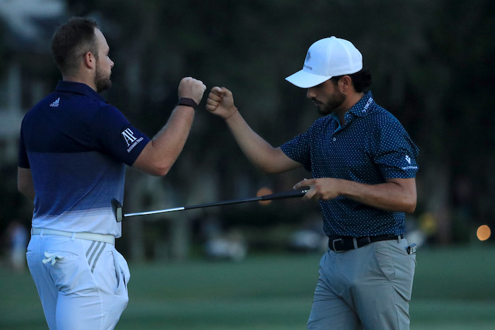 Tyrrell Hatton Abraham Ancer bump fists of the RBC Heritage