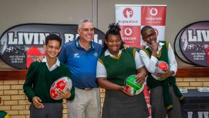 Sunshine Tour professional Hennie Otto with some of the learners of Ridgeview Primary School receiving the Living Ball sports balls
