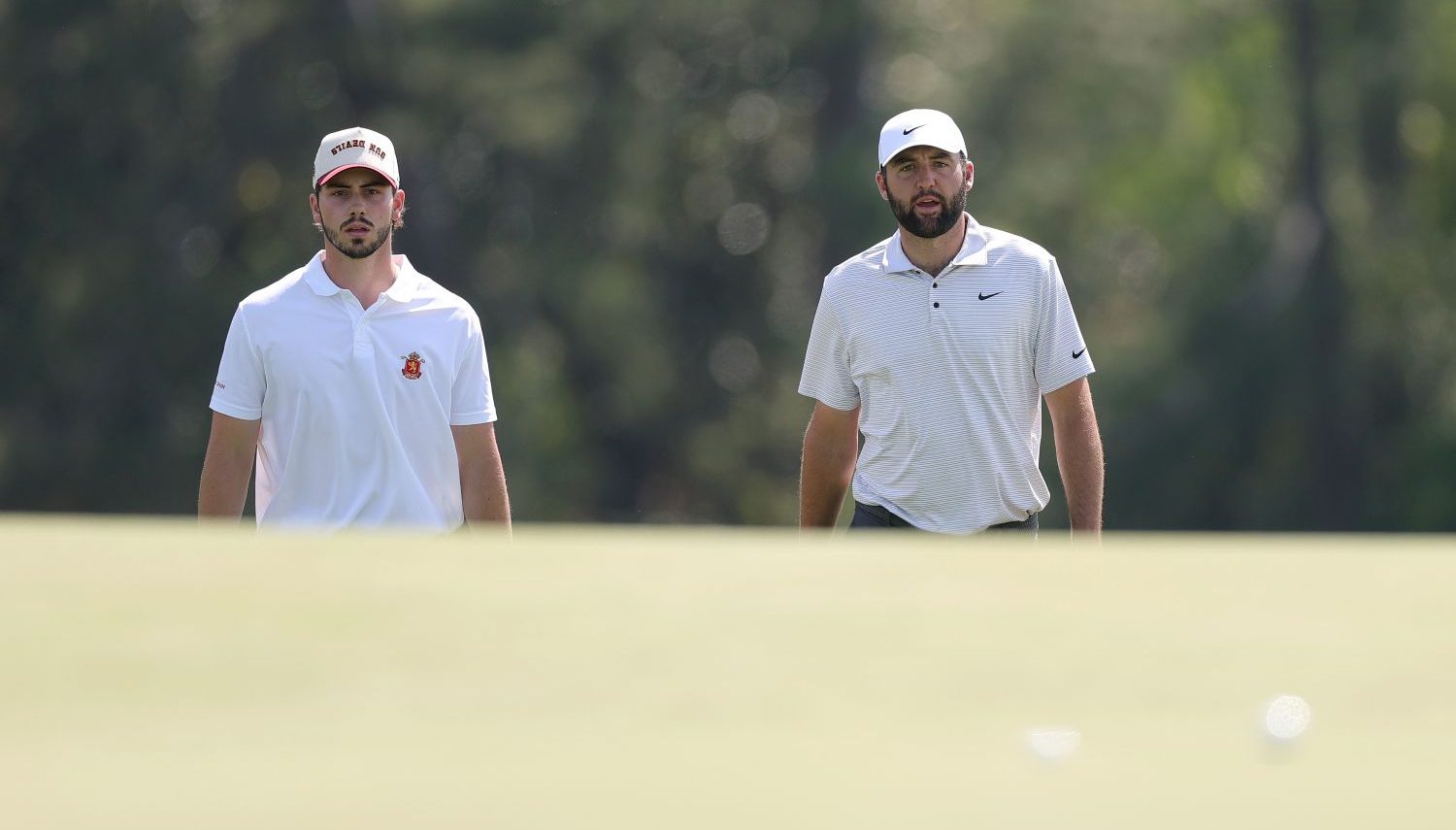 Scottie Scheffler of the United States and Amateur Jose Luis Ballester of Spain walk on the 18th hole during the first round of the 2025 Masters Tournament at Augusta National Golf Club on April 10, 2025 in Augusta, Georgia. (Photo by Andrew Redington/Getty Images)