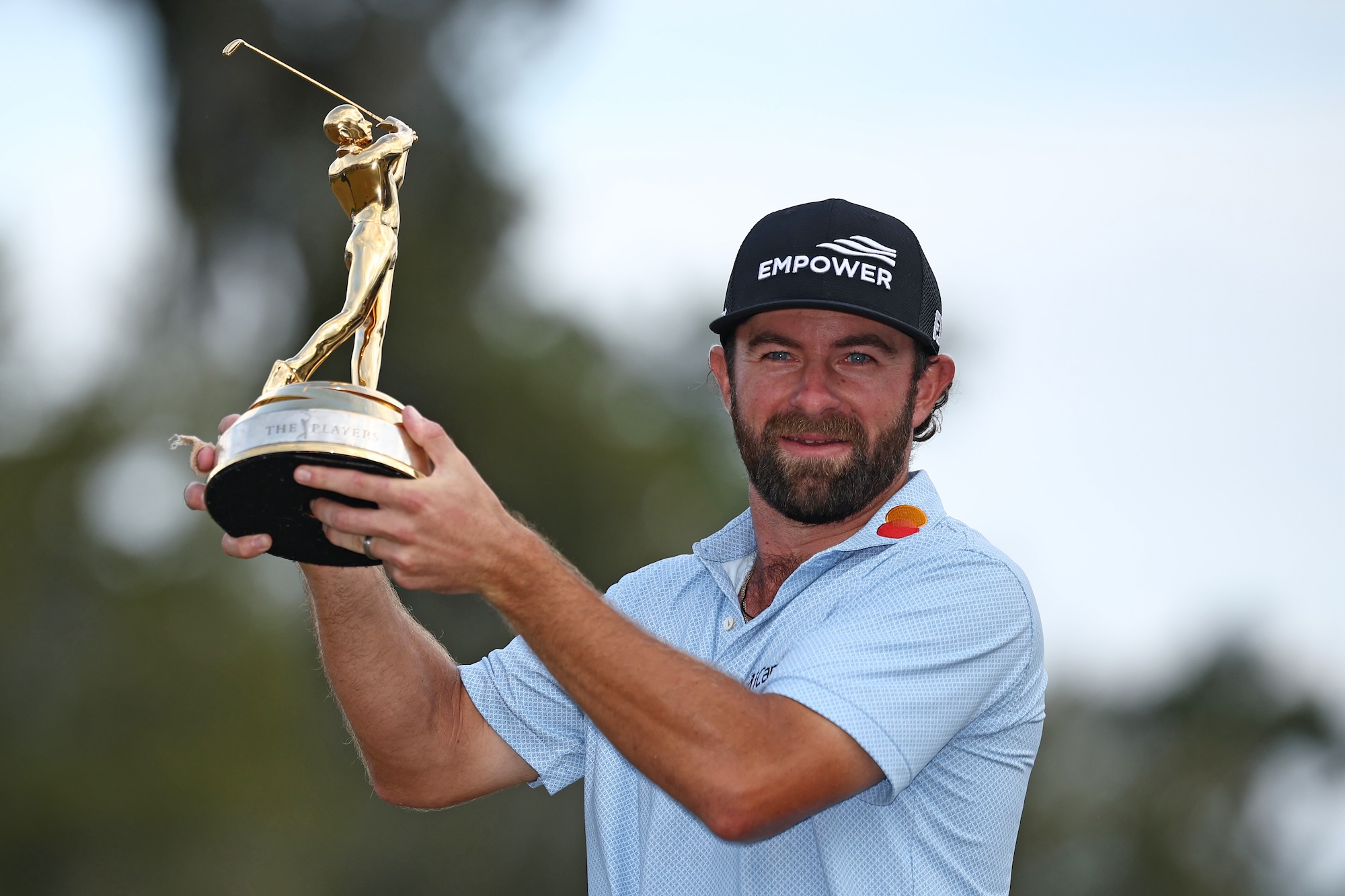 PONTE VEDRA BEACH, FLORIDA - MARCH 15: Cameron Young of the United States poses with the winner's trophy after winning THE PLAYERS Championship 2026 at THE PLAYERS Stadium course at TPC Sawgrass on March 15, 2026 in Ponte Vedra Beach, Florida. (Photo by Jared C. Tilton/Getty Images)
